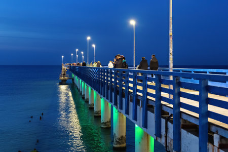 ZELENOGRADSK, KALININGRAD REGION, RUSSIA - OKTOBER 25, 2020: View of the pedestrian long mole on the Baltic Sea coast in famous resort Zelenogradsk (formerly known as Cranz) at evening time.のeditorial素材