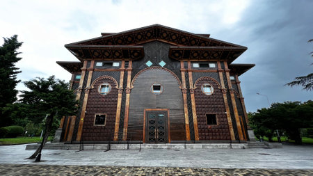 BATUMI, GEORGIA - JUNE 23, 2023: View of the Batumi Summer Theater. Is located in the very center of the city in a beautiful park that runs along the resort waterfront. Wooden building built in 2013.のeditorial素材