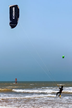 ESSAOUIRA, MOROCCO - JUNE 10, 2017: Kiteboarding activities on the Atlantic ocean waves in the Essaouira.のeditorial素材