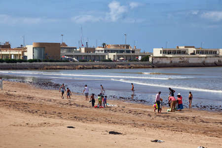 EL JADIDA, MOROCCO - JUNE 13, 2017: Unknown local people on the sandy beach of El Jadida (Mazagan). This town is a major port city on the Atlantic coast of Morocco. africa.のeditorial素材