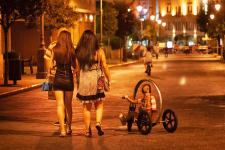 BEIRUT, LEBANON - AUGUST 14, 2014: Unknown young women walking in center of Beirut (Centre Ville or Beirut Central District (BCD) at evening time.のeditorial素材