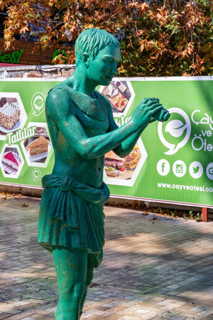 ANTALYA, TURKEY - JULY 08, 2018: Modern urban sculpture (a man with a camera dressed in ancient Roman clothes) on the street of Antalya.のeditorial素材