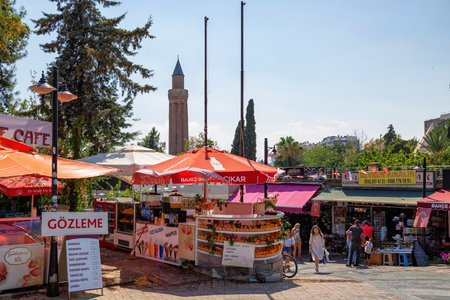 ANTALYA, TURKEY - JULY 08, 2018: The cityscape of Antalya with view on the minaret of Yivliminare Mosque (built by the Anatolian Seljuk Sultan Alaaddin Keykubad I). It is located in Kaleici old town.のeditorial素材