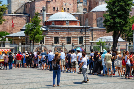 ISTANBUL, TURKEY - JULY 05, 2018: Group of unknown tourists waiting in line to visit of the Holy Hagia Sophia Grand Mosque.のeditorial素材