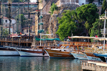ANTALYA, TURKEY - JULY 08, 2018: Wooden ships waiting for a cruise in the Mediterranean Sea in the old city marina (Roman harbor). Boating is a very popular form of recreation in the Mediterranean.のeditorial素材