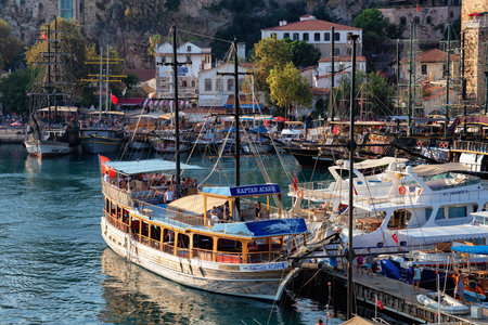 ANTALYA, TURKEY - JULY 08, 2018: Wooden ship waiting for a cruise in the Mediterranean Sea in the old city marina (Roman harbor). Boating is a very popular form of recreation in the Mediterranean.のeditorial素材