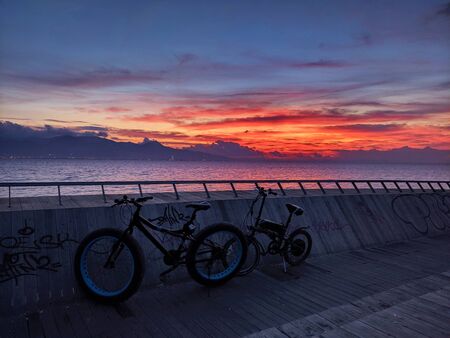 Watching the unique sunset after sportsの写真素材