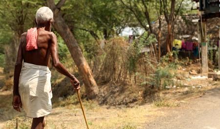 NANNILAM, INDIA - 19 MAY 2016: Indian man walking at the street.のeditorial素材