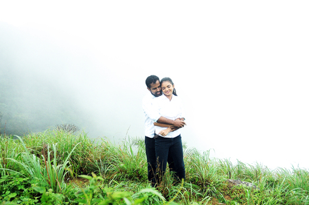 OOTY, INDIA - 30 JUNE, 2015: Hugging couple in high mountains, couple hugging in beautiful mountains,のeditorial素材