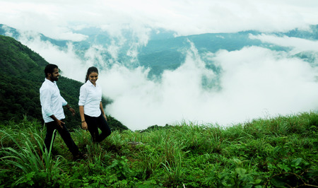 KODAIKANAL, INDIA - 30 JUNE, 2015: happy young loving couple having fun outdoor in summertimeのeditorial素材