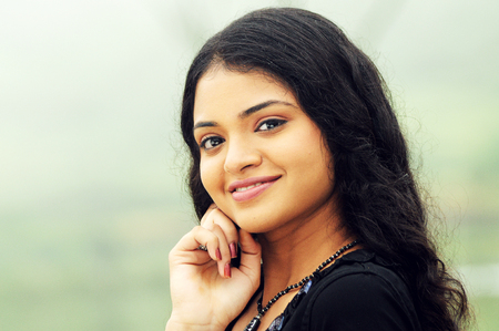 KODAIKANAL, INDIA - JUNE 30TH, 2015: smiling beautiful woman looking at cameraのeditorial素材