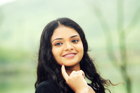 KODAIKANAL, INDIA - JUNE 30TH, 2015: smiling beautiful woman looking at cameraのeditorial素材