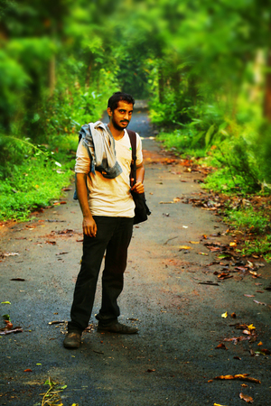 Young man happy hiker looking at Camera in the nature.のeditorial素材