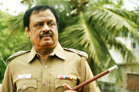 Indian police officer looking at outside