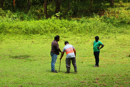 Happy friends spending time together outside in green nature.のeditorial素材