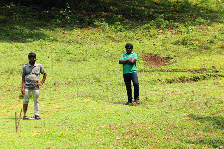 Happy friends spending time together outside in green nature.のeditorial素材
