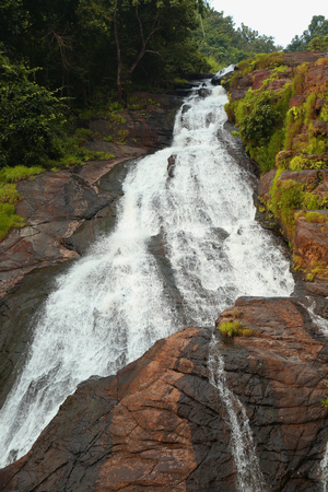 A waterfall in the mountain.の写真素材