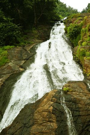 A waterfall in the mountain.の写真素材