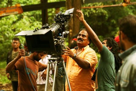 Camera operator on nature background, film shooting spotのeditorial素材