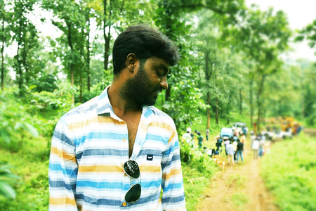 handsome teen boy looking up nature backgroundのeditorial素材