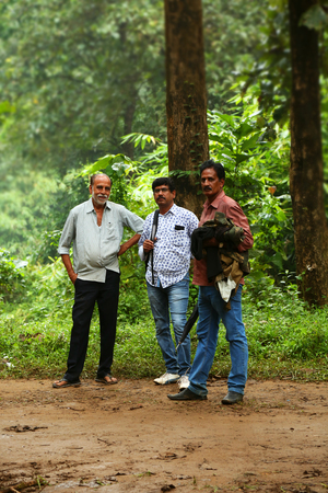 Three people are looking at camera and smilingのeditorial素材