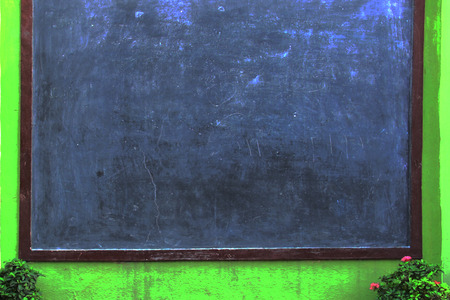 Blank Blackboard Background, Village exterior Blackboard with flowers Background.の写真素材