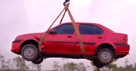 pick up towed car on tow truck.Emergency towing of car on truck