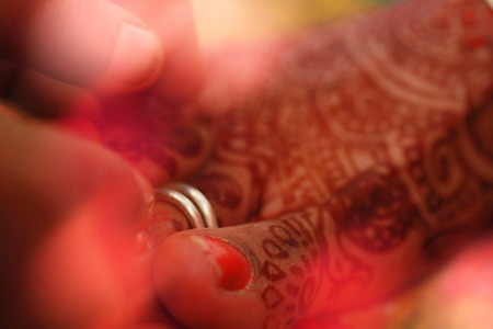 Closeup leg with arts, wedding rituals of bride and groom with wedding backgroundの写真素材