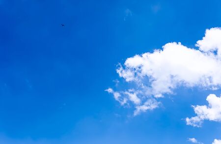 Blue sky background with cloudの写真素材