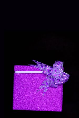 Christmas holidays gift box on black background with copy space for y textの写真素材