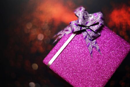 Merry Christmas and happy new year with gift box at blur bokeh light backgroundsの写真素材