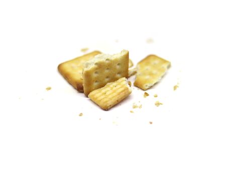 Biscuits crushed into pieces close-up isolated on a white backgroundsの写真素材