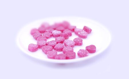 Bright colored candy sweets on a white background