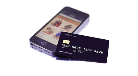 smartphone and international debit card on white backgroundのeditorial素材