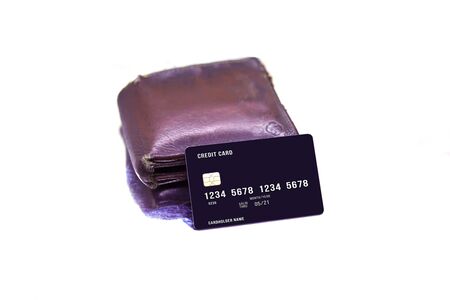 men's purse with credit and debit cards on the white tablesの写真素材