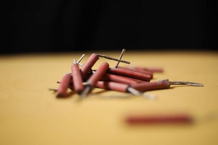 firecrackers for Diwali festival on black and yellow backgroundsの写真素材
