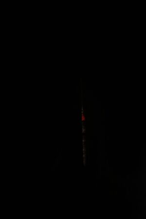 Burning sparkler firework against a black backgrounds