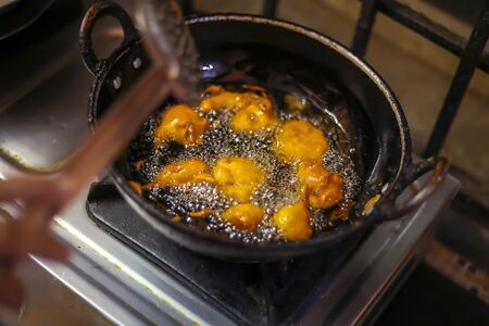 Onion bajji, deep fried onion bhajis in home kitchen