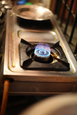 Closeup of the fire burner on the gas kitchen stove,の写真素材