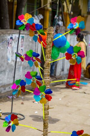 vendor selling colorful plastic windmill on Indian temple festivalの写真素材