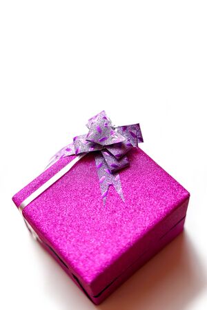Christmas gift boxes with colorful ribbon on white backgroundの写真素材