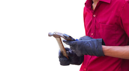 Cropped image of mechanics working in auto service. hand holding cutter with hammer