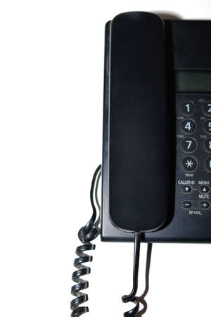 Top view of black telephone on white background