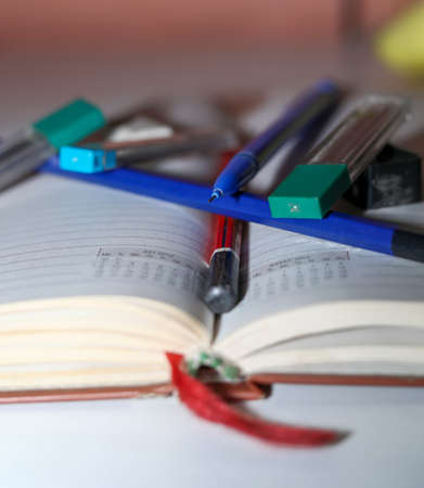 Back to school background with accessories for the schoolroom - paints, pencils, notebooks, books,