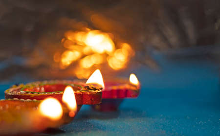 Beautiful clay diya lamps lit during diwali celebration,