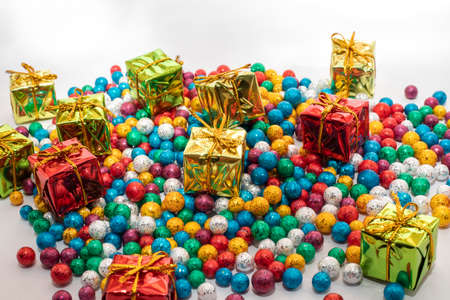 Gift boxes with colorful balls on white backgrounds