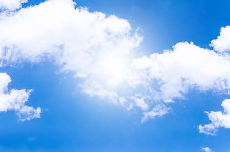 Blue sky with white clouds and sun lightsの写真素材