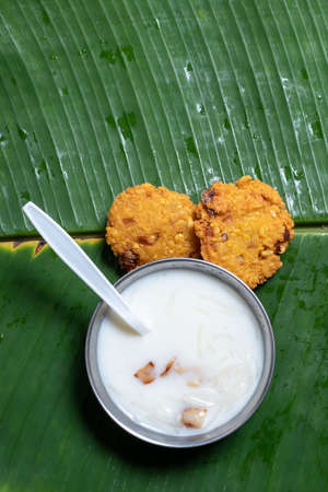 In traditional south asian (Indian) festivals, vegetarian dish masala vada and milk payasam are...
