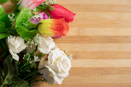 Valentine's Day backgrounds. Beautiful bouquet yellow and red and white roses on the table.の写真素材