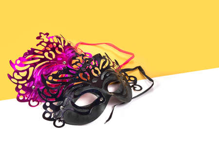 Multicolored carnival mask on yellow-white backgrounds.の写真素材